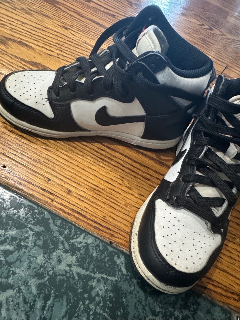 Nike Black and White Mid-Top Sneakers with Red Logo